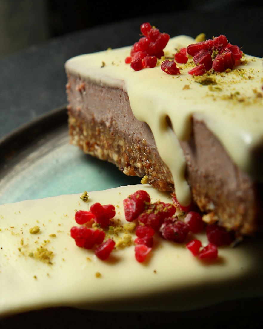 Raw cake slice with pistachio